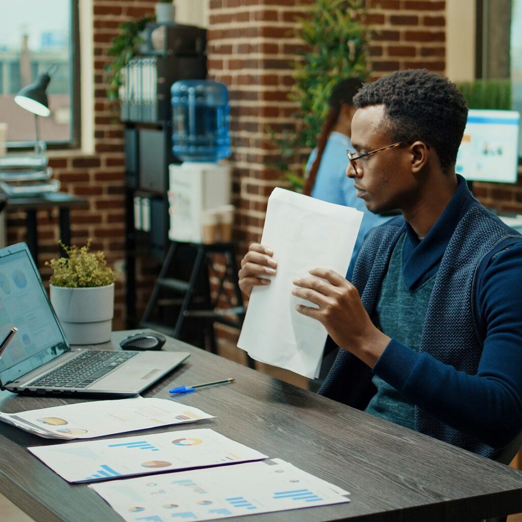 African american manager examining files