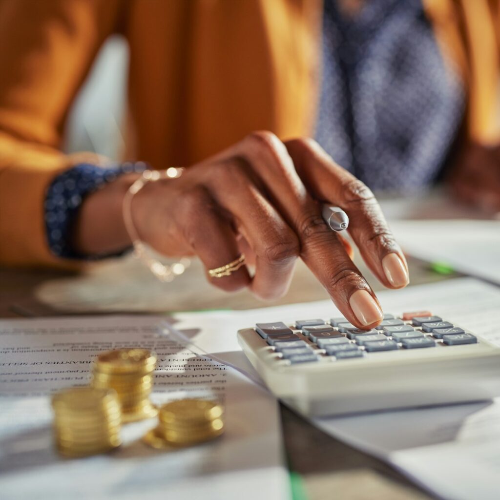 Black woman hand calculating taxes