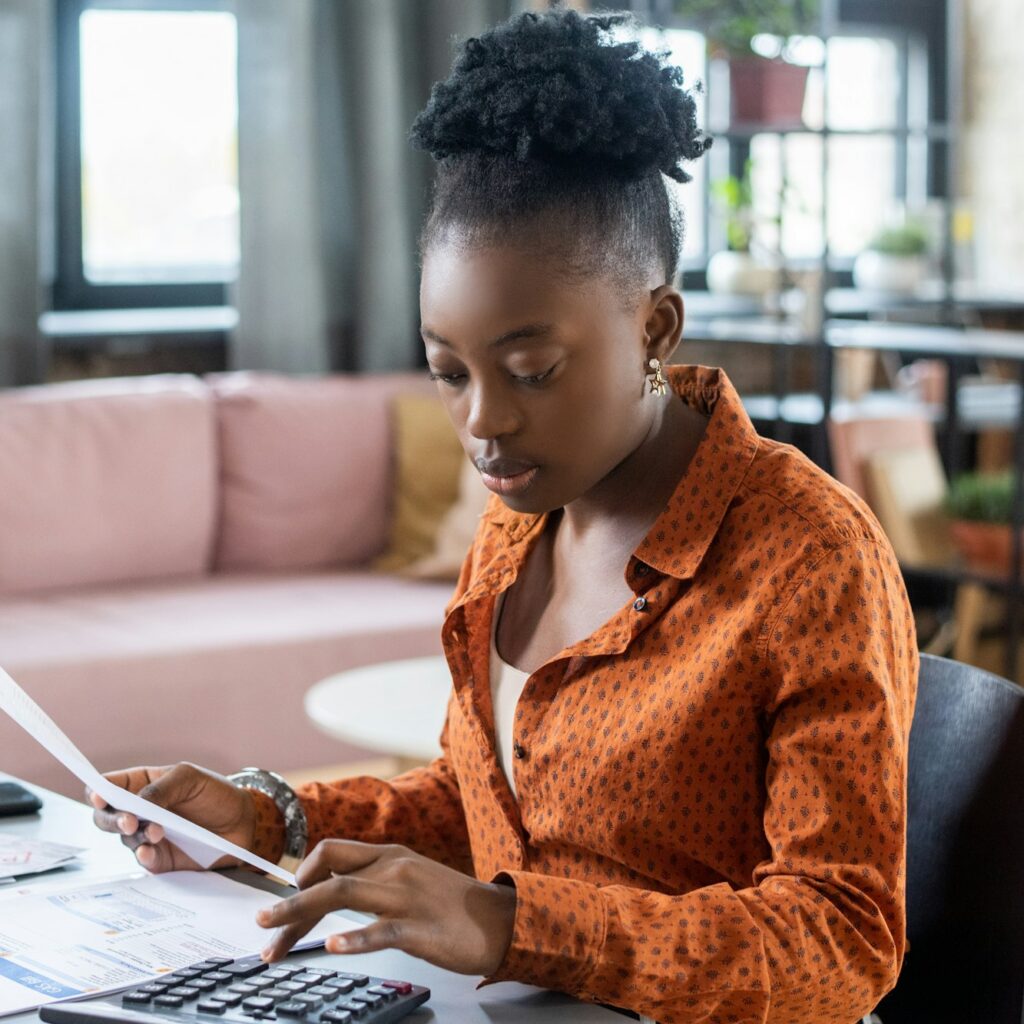 Blackwoman Calculating Tax Bill