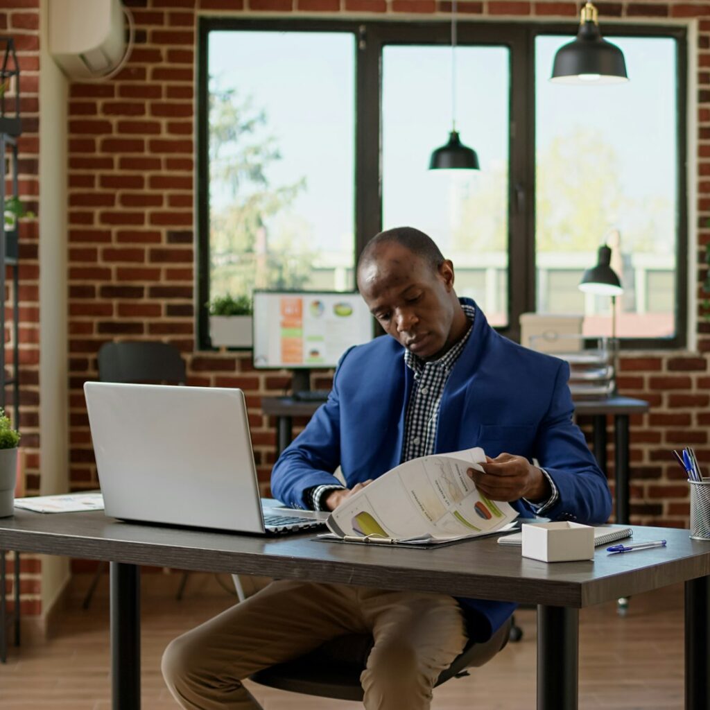 Financial analyst looking at business report documents