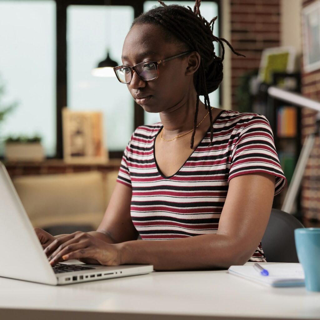 Freelancer working, typing on laptop keyboard, searching information