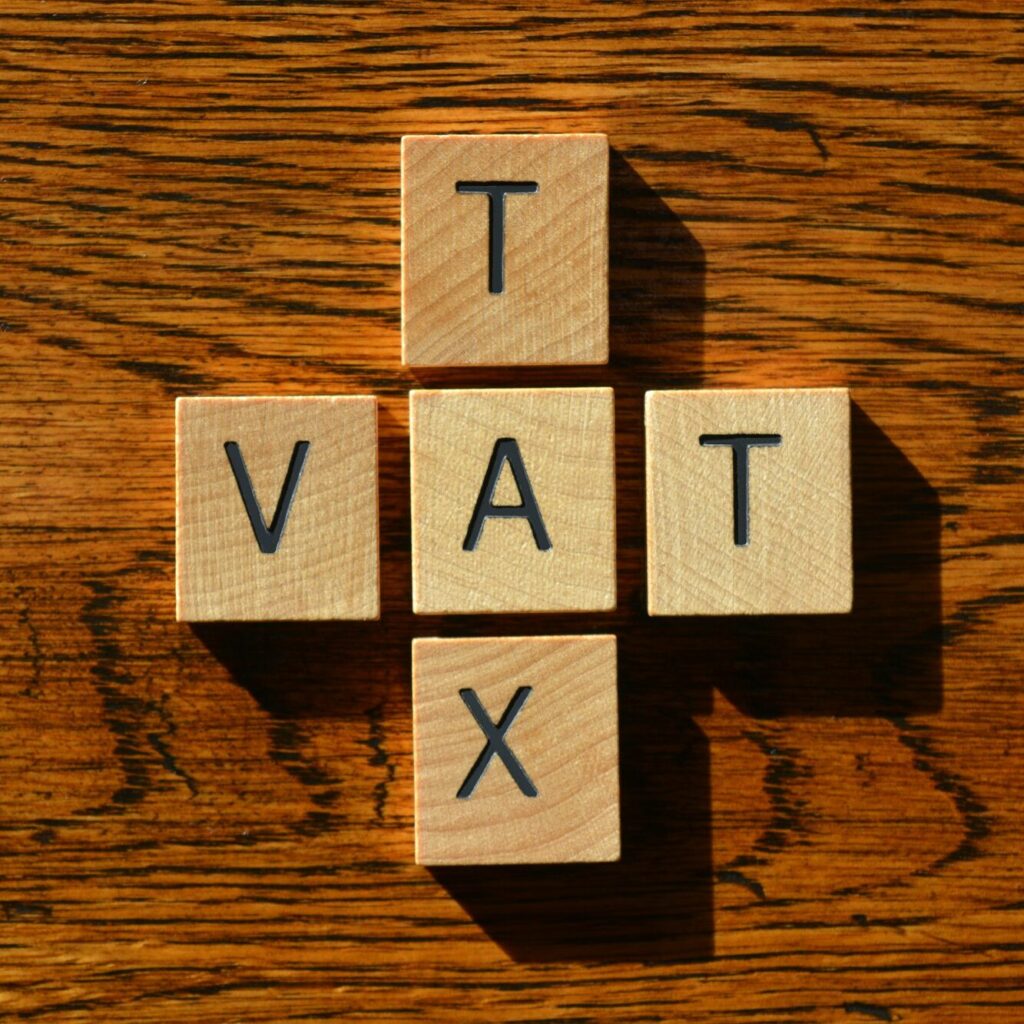 Wooden cubes spelling TAX and VAT for Kenyan businesses – Zidika Consulting